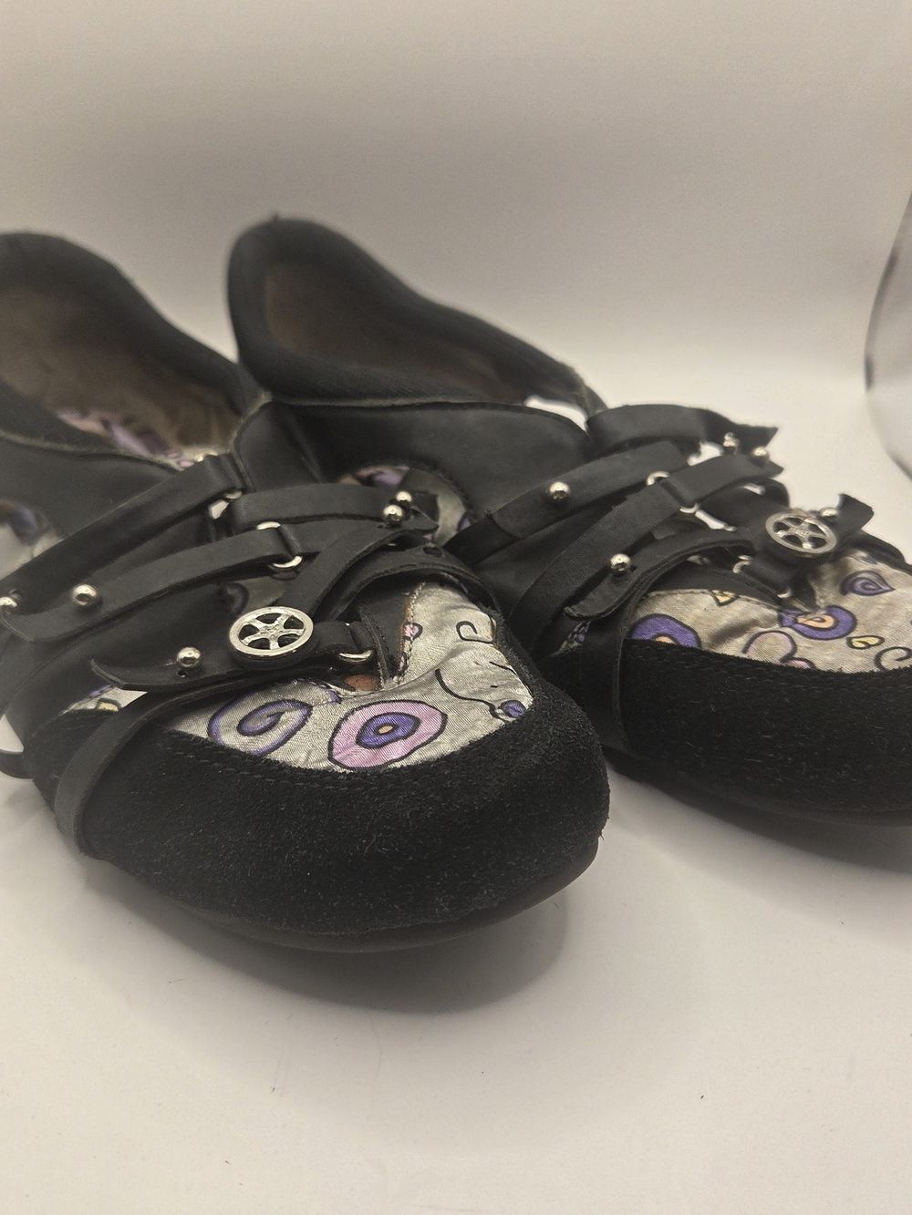 Morenatom brand shoes feature a distinct silver and purple pattern